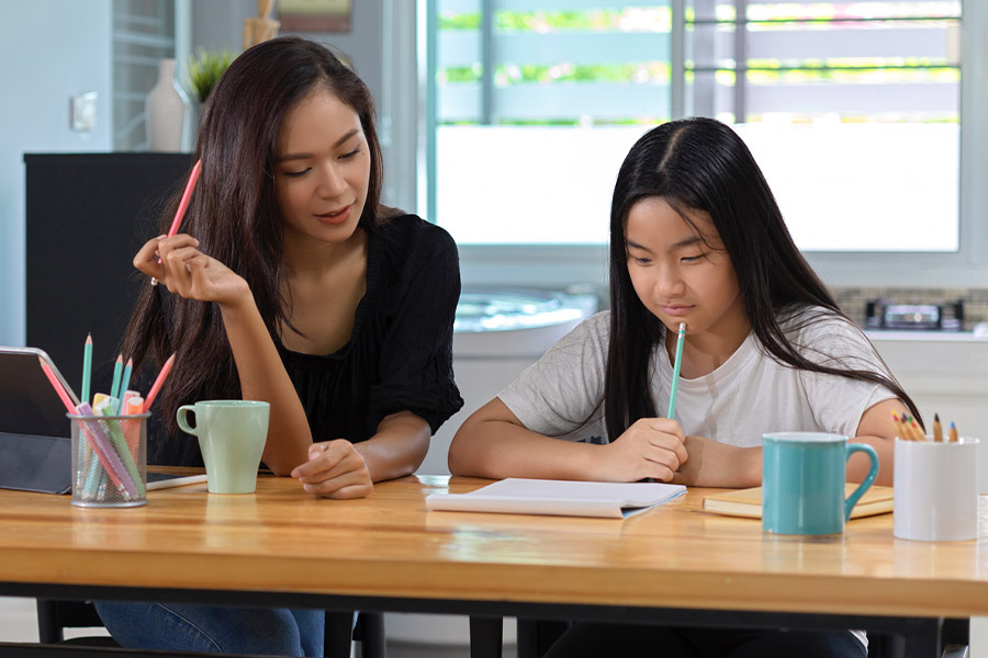 student and tutor together at a desk in Portland